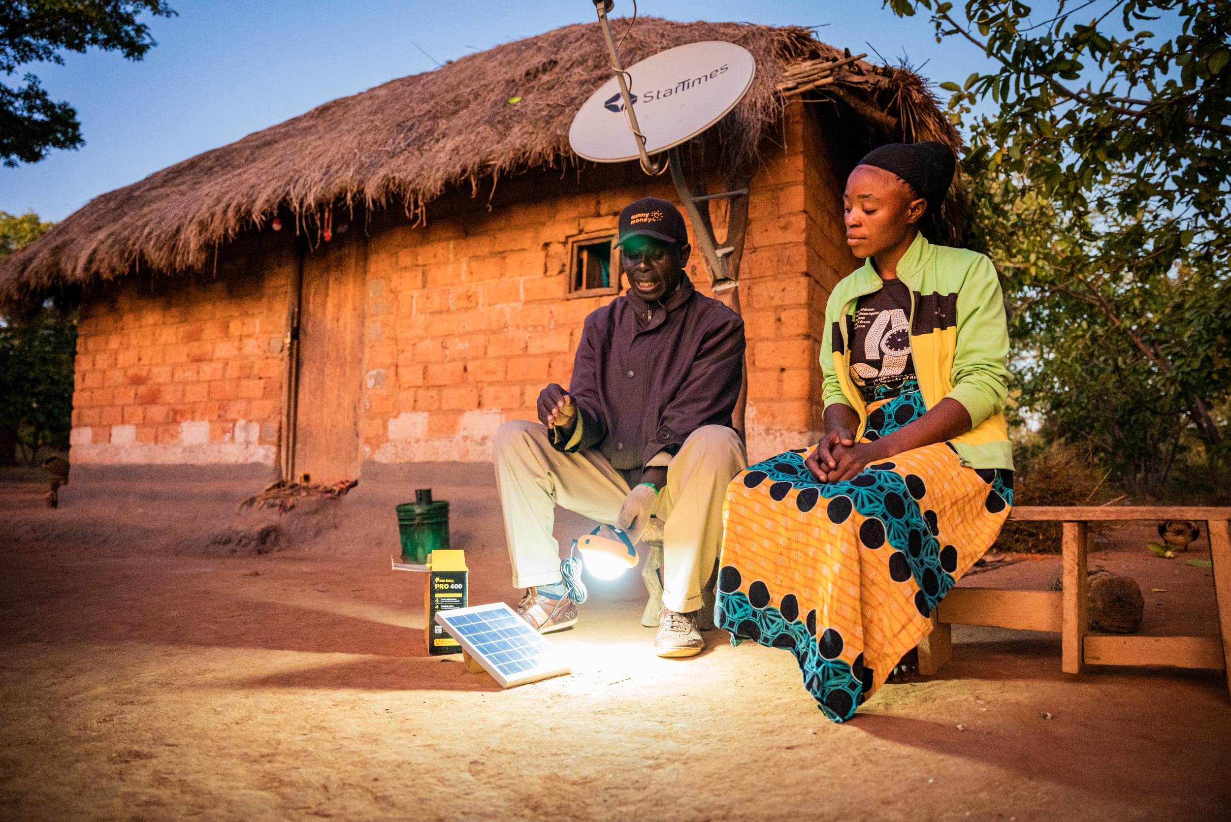Solar-Entrepreneur-Penny-Mupeta-with-customer-Missaly-Kalale-SKP-400-Zambia-Large.jpg